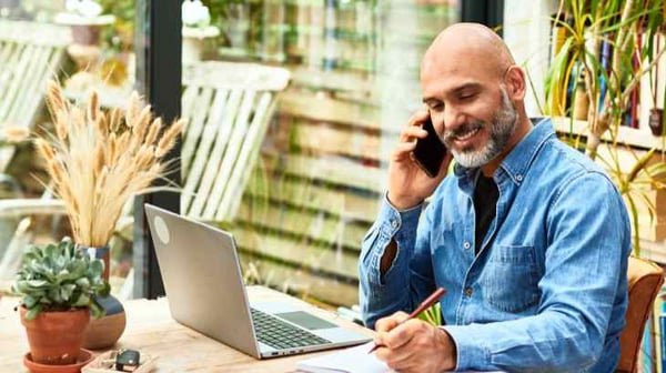 Man on phone indoors