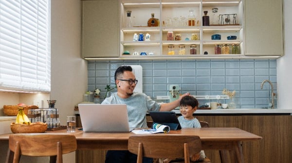 Image showing father and young son sitting in the kitchen
