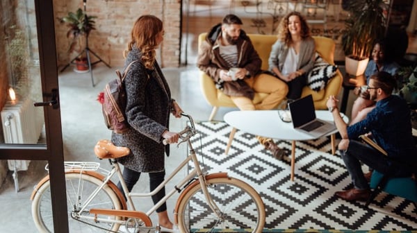Woman with bike in a shop
