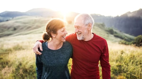 Two people walking in the hills