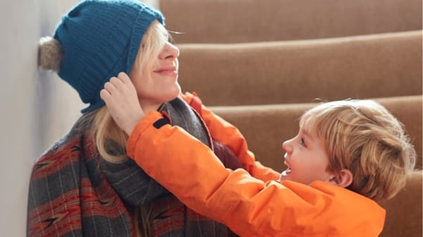Young woman playing with child